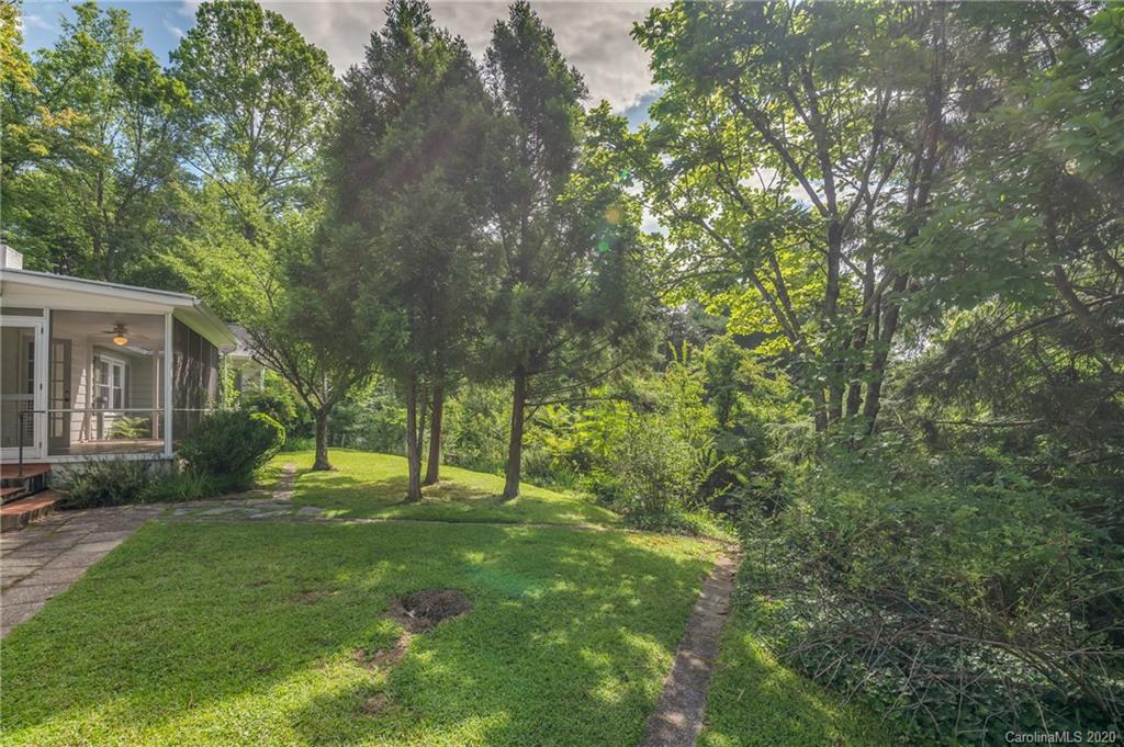 300 Doubleday Road Tryon, NC 28782 - Photo 31 of 38 a view of a backyard with a garden