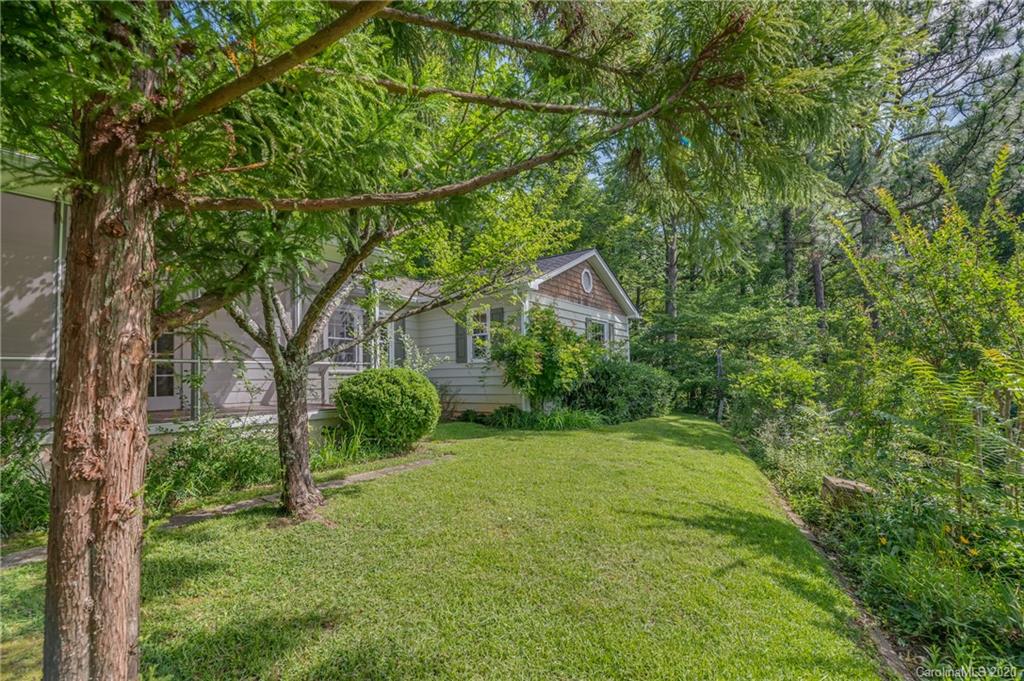300 Doubleday Road Tryon, NC 28782 - Photo 34 of 38 a view of a house with a backyard