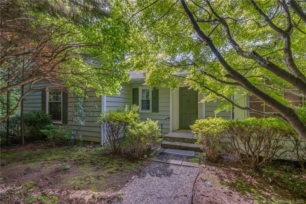 300 Doubleday Road Tryon, NC 28782 - Photo 5 of 38 a view of a house with a yard and plants