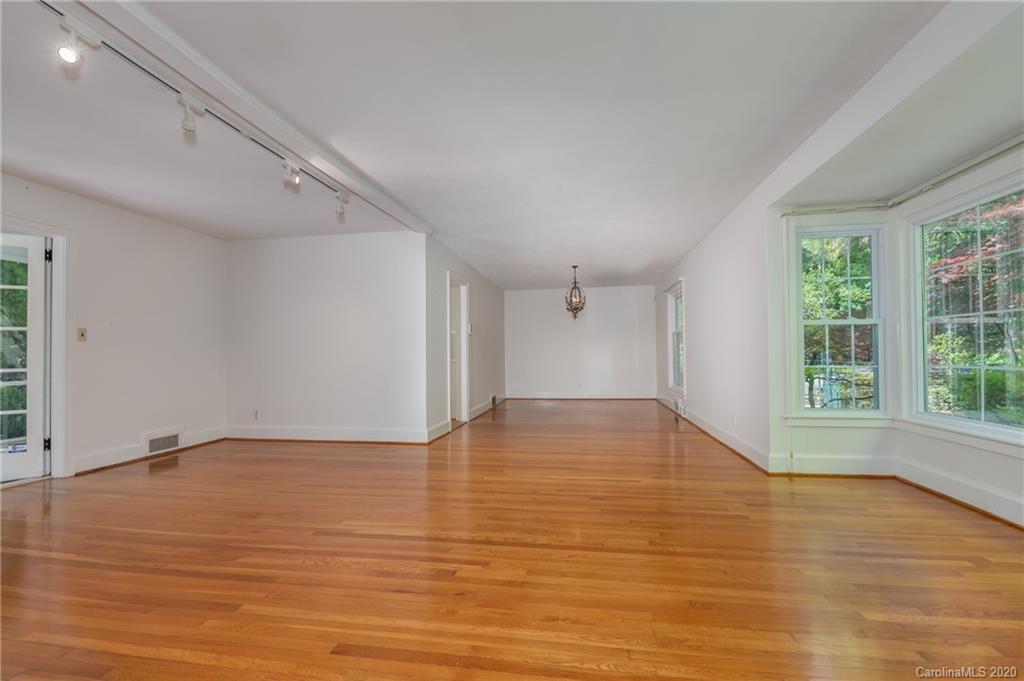 300 Doubleday Road Tryon, NC 28782 - Photo 8 of 38 a view of empty room with wooden floor and fan