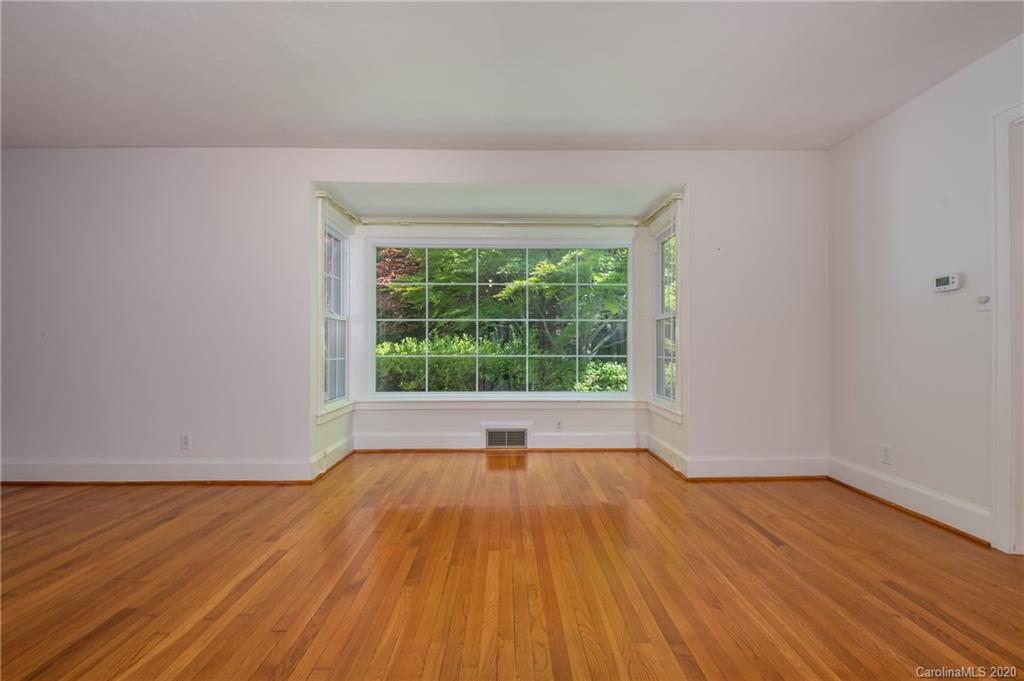 300 Doubleday Road Tryon, NC 28782 - Photo 10 of 38 a view of empty room with wooden floor and fan