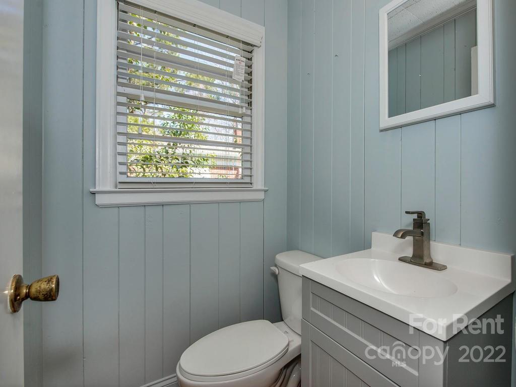 943 B Norland Road, Unit B Charlotte, NC 28205 - Photo 11 of 17 a bathroom with a sink a toilet and a window