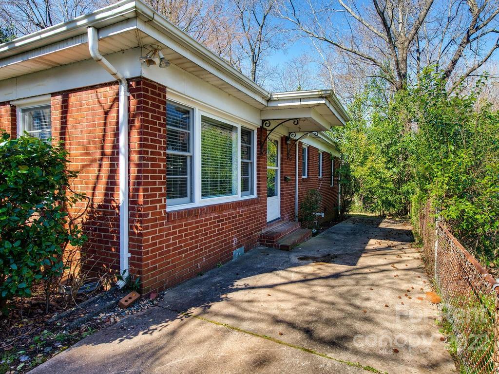 943 B Norland Road, Unit B Charlotte, NC 28205 - Photo 2 of 17 a front view of a house with garden