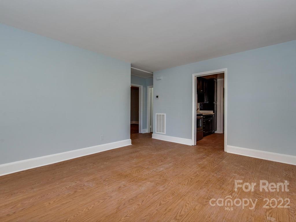 943 B Norland Road, Unit B Charlotte, NC 28205 - Photo 7 of 17 an empty room with closet and a bathroom