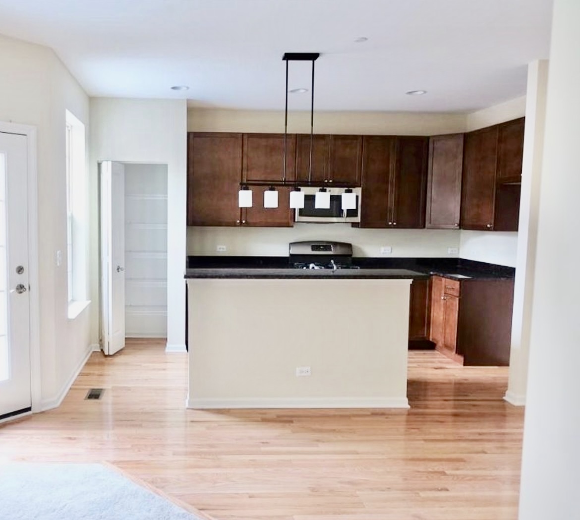 2018 Shermer Road, Unit 2018 Glenview, IL 60026 - Photo 7 of 39 a kitchen view with stainless steel appliances granite countertop a stove a sink and a refrigerator