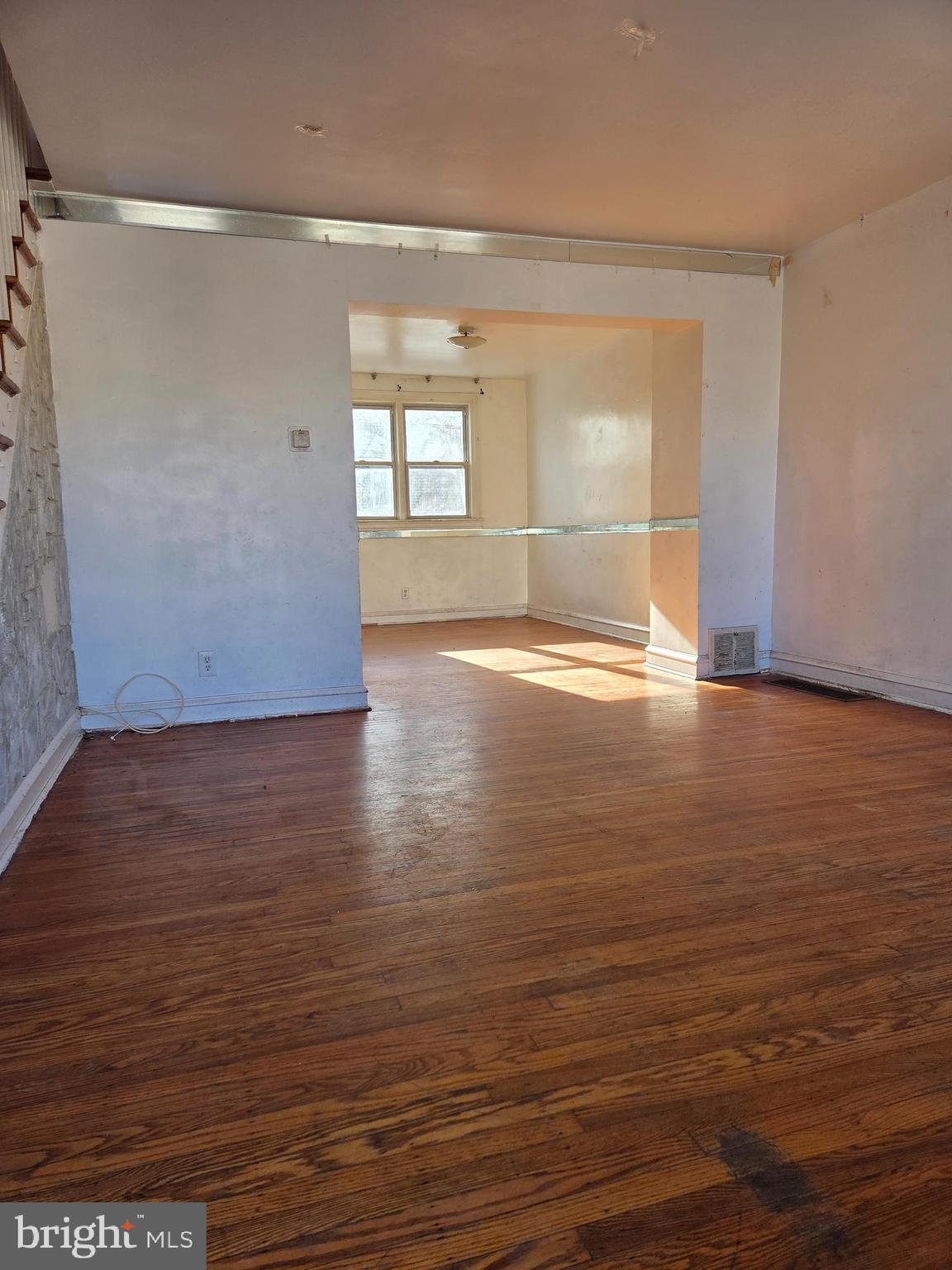 2912 Passmore Street Philadelphia, PA 19149 - Photo 2 of 13 wooden floor in an empty room with a window