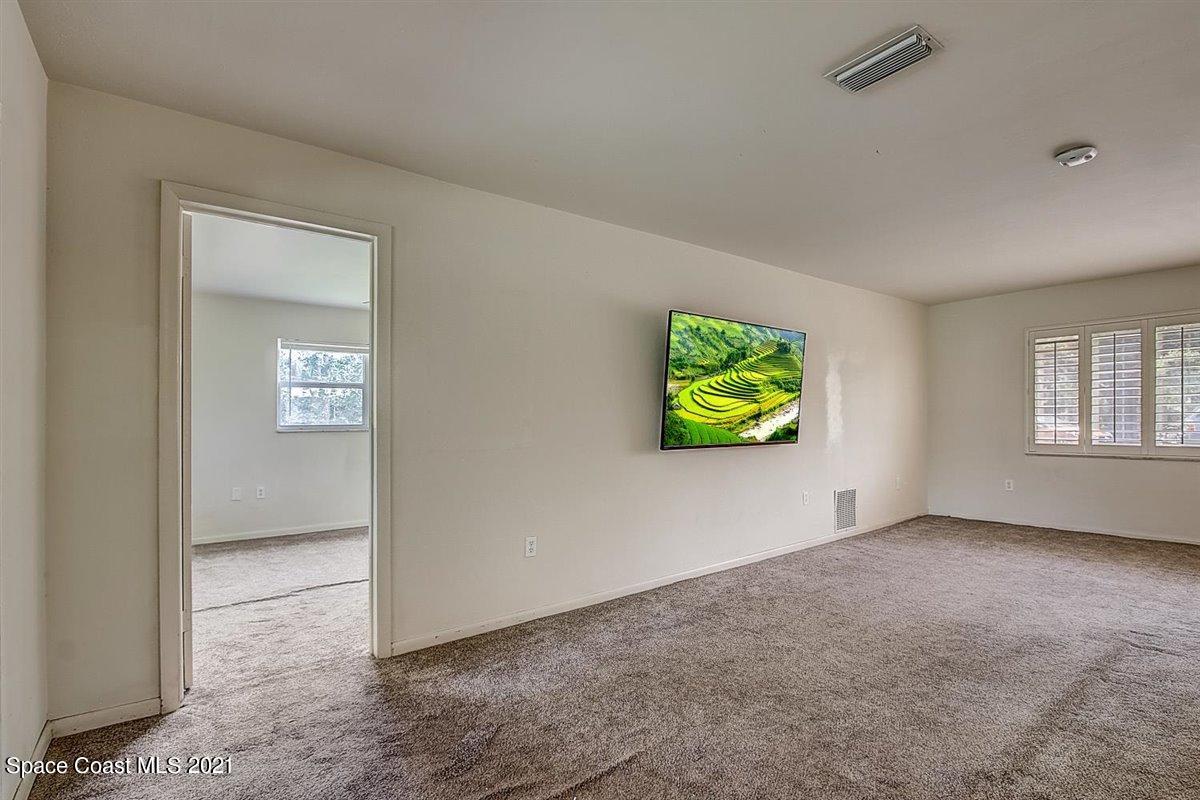 805 Knecht Road Northeast Palm Bay, FL 32905 - Photo 11 of 42 an empty room with windows and closet