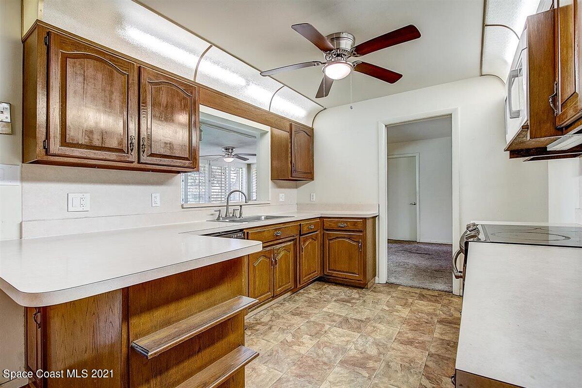 805 Knecht Road Northeast Palm Bay, FL 32905 - Photo 15 of 42 a spacious bathroom with a sink a mirror and bathtub