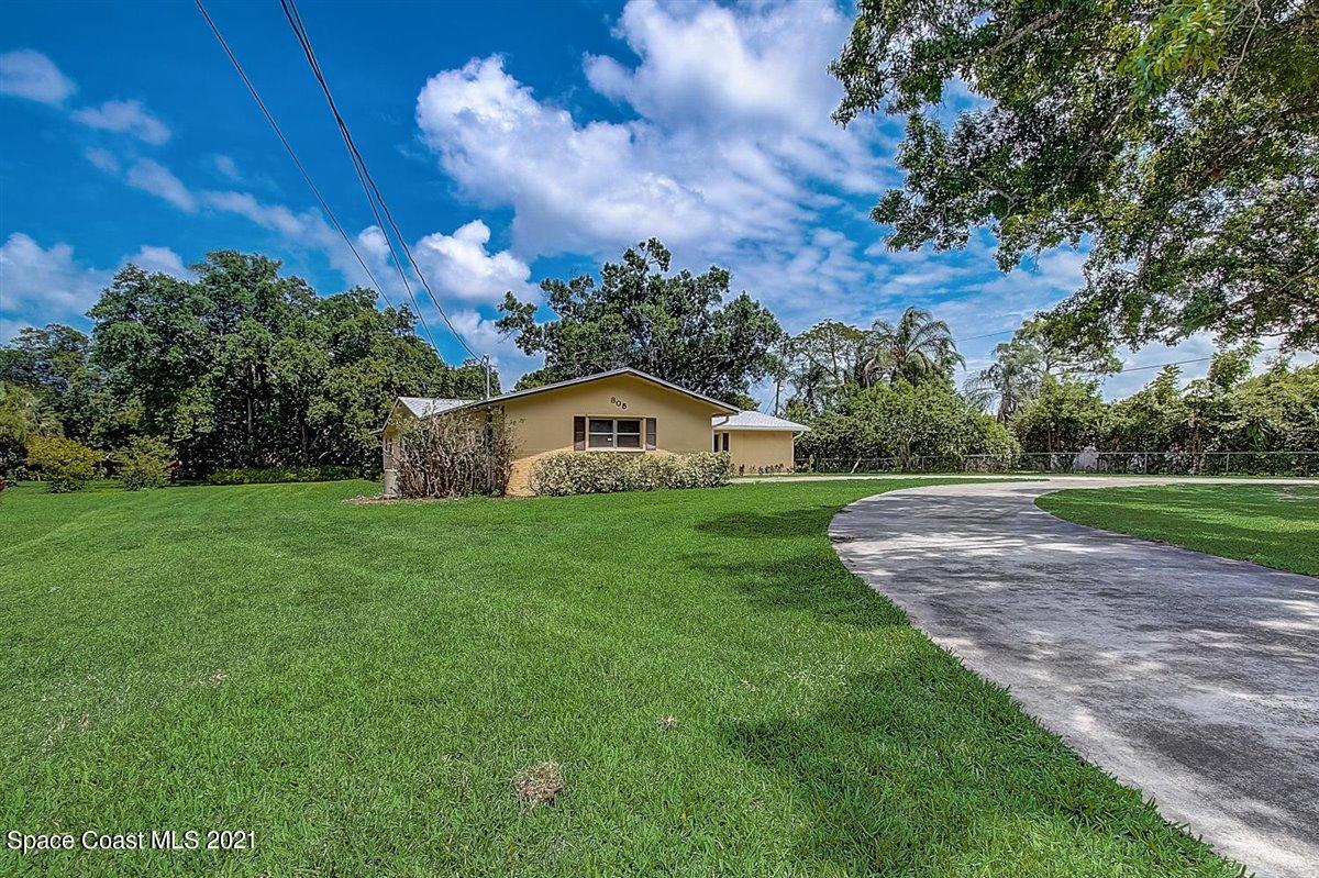 805 Knecht Road Northeast Palm Bay, FL 32905 - Photo 3 of 42 a view of a house with a big yard