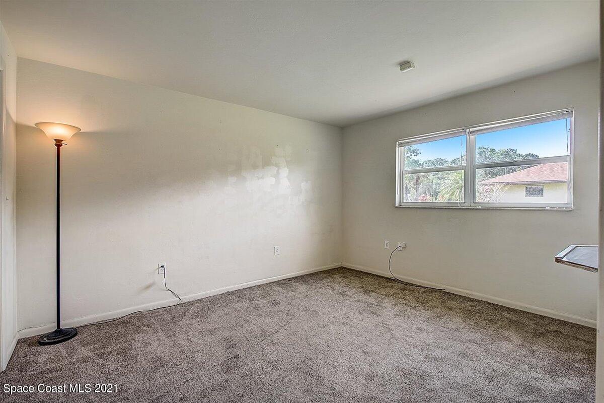 805 Knecht Road Northeast Palm Bay, FL 32905 - Photo 23 of 42 a view of an empty room with a window