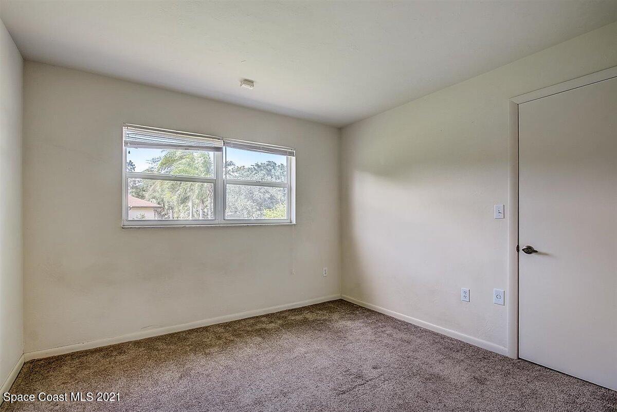805 Knecht Road Northeast Palm Bay, FL 32905 - Photo 25 of 42 an empty room with a window