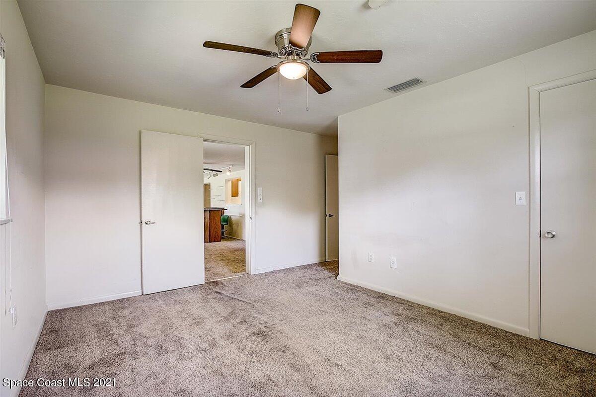 805 Knecht Road Northeast Palm Bay, FL 32905 - Photo 30 of 42 a view of empty room with ceiling fan