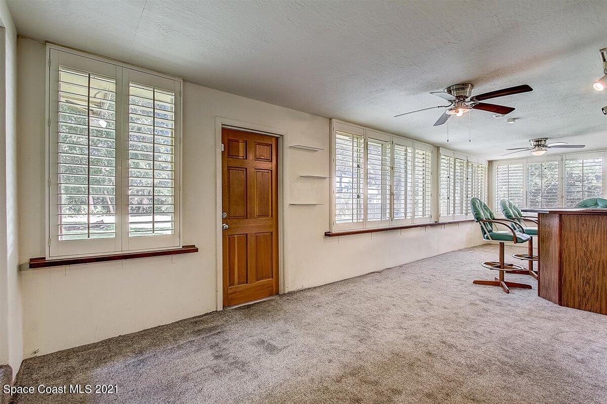 805 Knecht Road Northeast Palm Bay, FL 32905 - Photo 33 of 42 a living room with furniture and a window