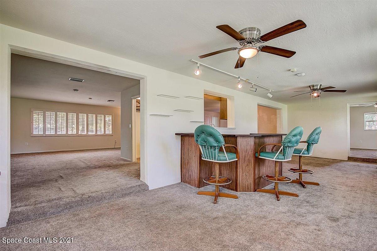 805 Knecht Road Northeast Palm Bay, FL 32905 - Photo 35 of 42 a view of a livingroom with furniture and a window