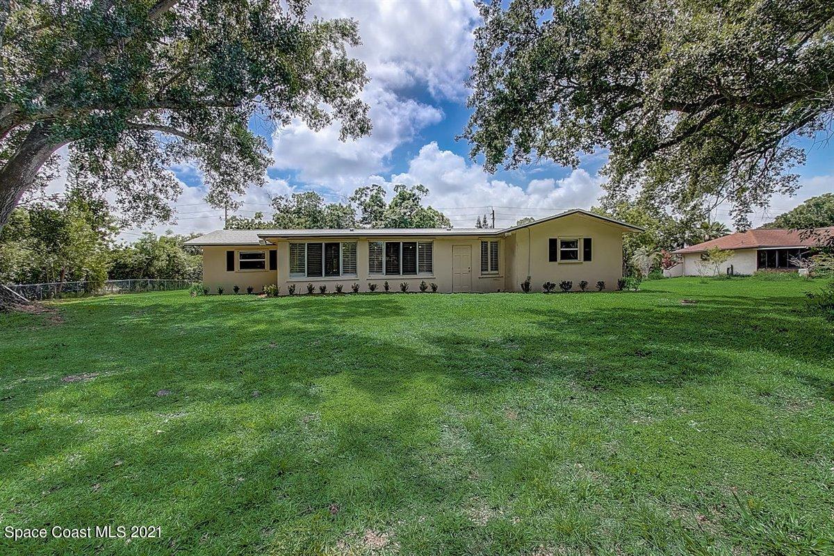 805 Knecht Road Northeast Palm Bay, FL 32905 - Photo 36 of 42 a view of a house with a big yard