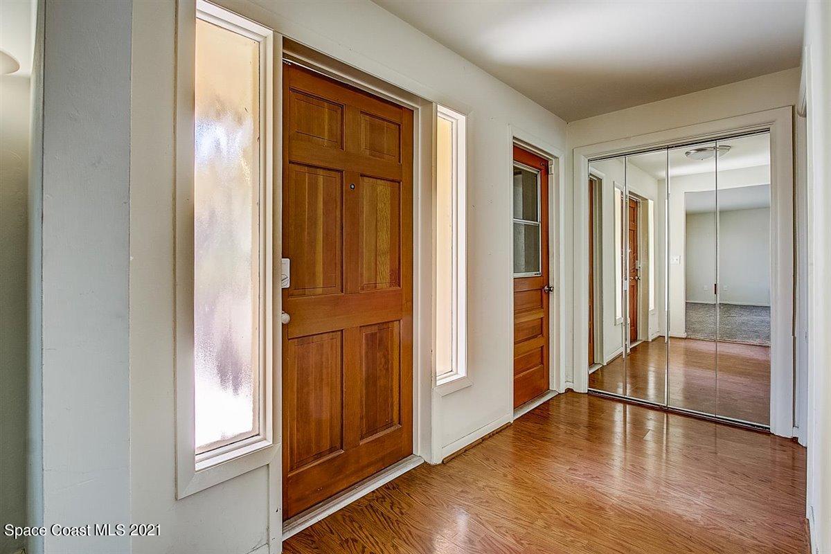 805 Knecht Road Northeast Palm Bay, FL 32905 - Photo 7 of 42 an entryway with wooden floor