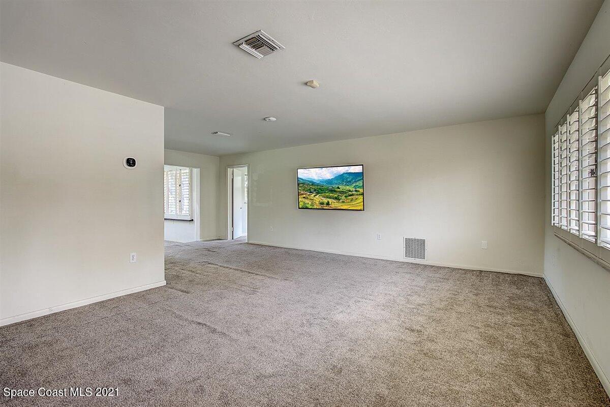 805 Knecht Road Northeast Palm Bay, FL 32905 - Photo 8 of 42 a view of an empty room with a window