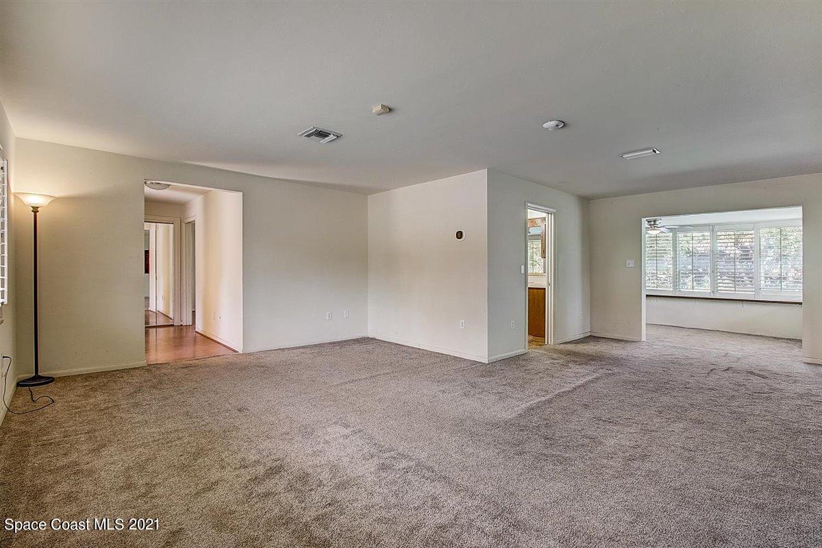 805 Knecht Road Northeast Palm Bay, FL 32905 - Photo 9 of 42 a view of an empty room with a window