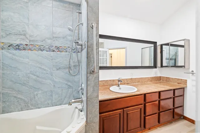 a view of balcony with wooden floor and fence