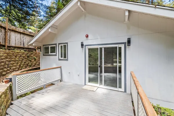 a view of a wooden door with a house