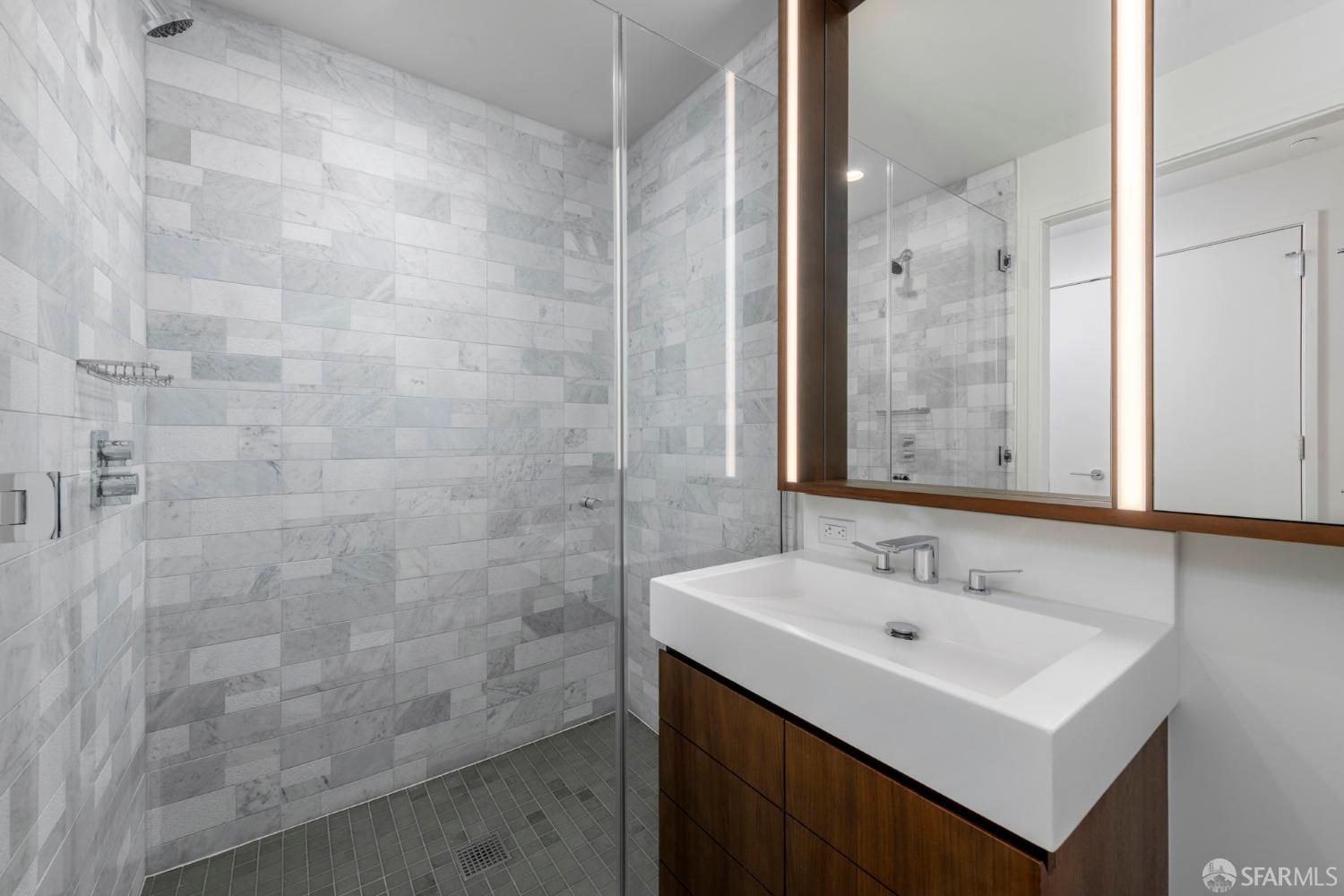 488 Folsom Street, Unit 4305 San Francisco, CA 94105 - Photo 20 of 45 a bathroom with a sink and a mirror