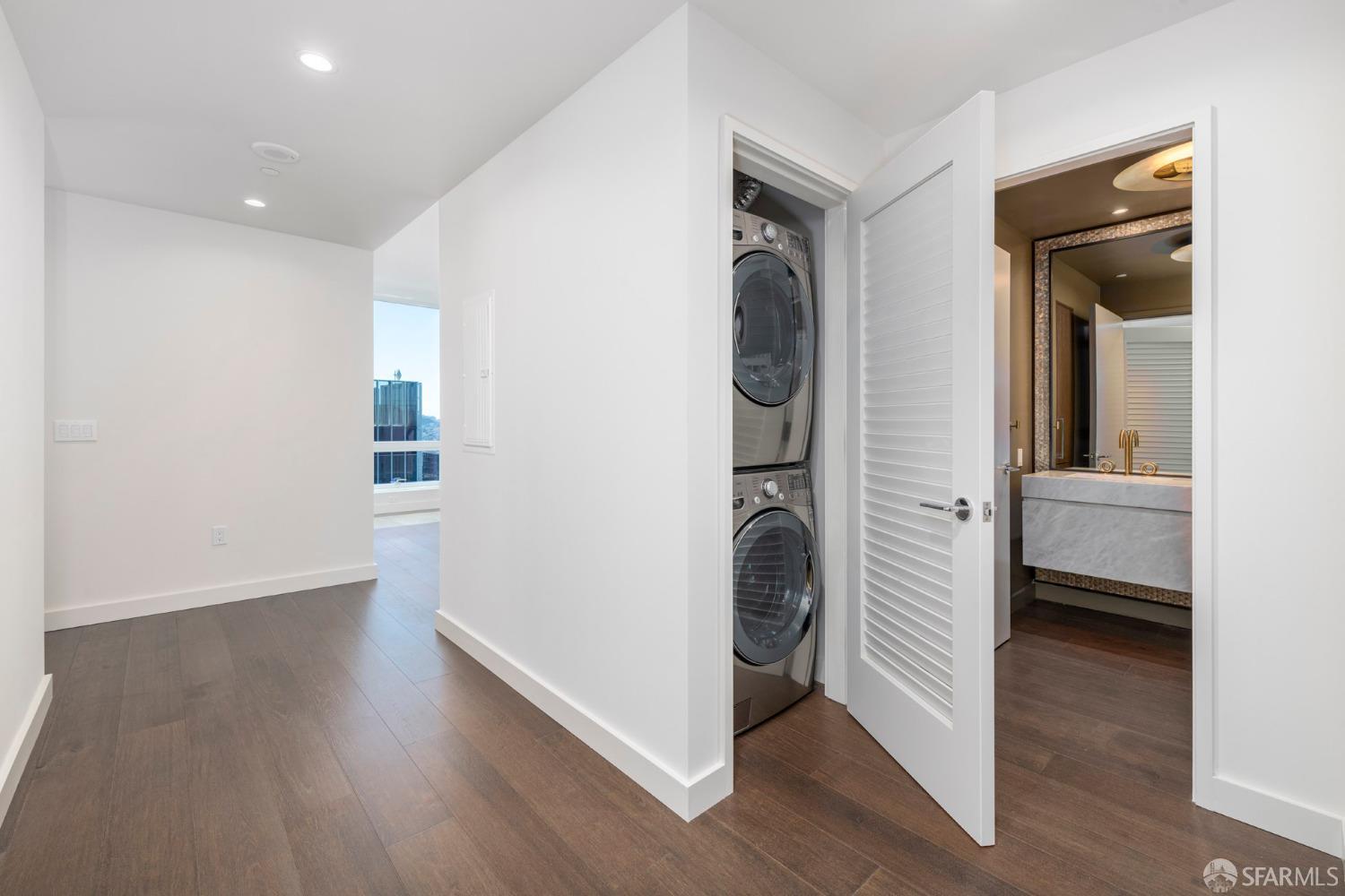488 Folsom Street, Unit 4305 San Francisco, CA 94105 - Photo 21 of 45 a view of a hallway with bathroom and wooden floor
