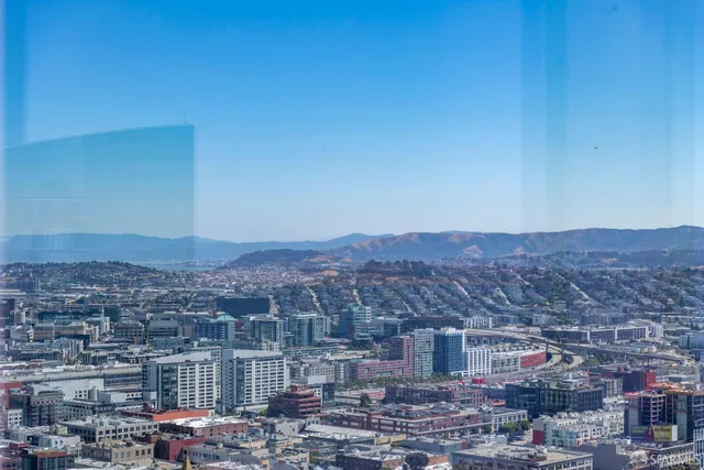 a room with gym equipment and a large window
