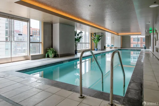 a living room with lots of furniture and white walls
