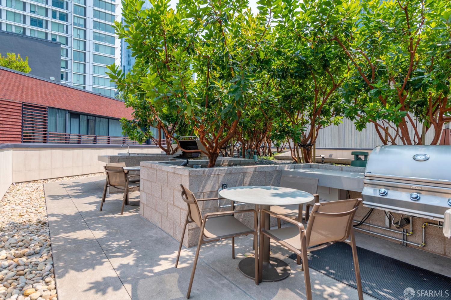 488 Folsom Street, Unit 4305 San Francisco, CA 94105 - Photo 42 of 45 a view of a patio with table and chairs and potted plants