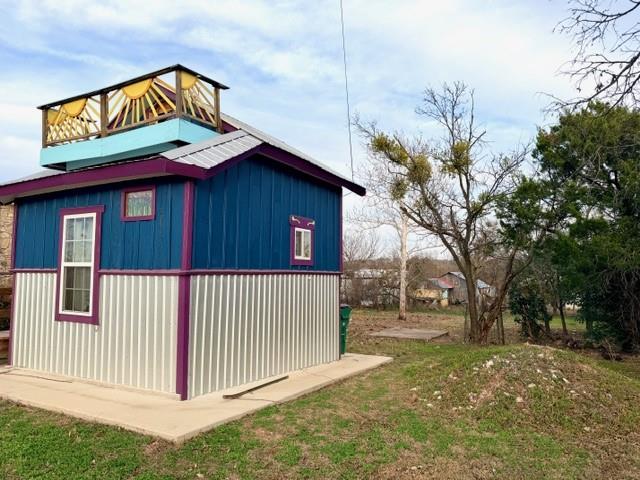 1608 School Street Goldthwaite, TX 76844 - Photo 4 of 25 a view of a house with a yard and wooden fence