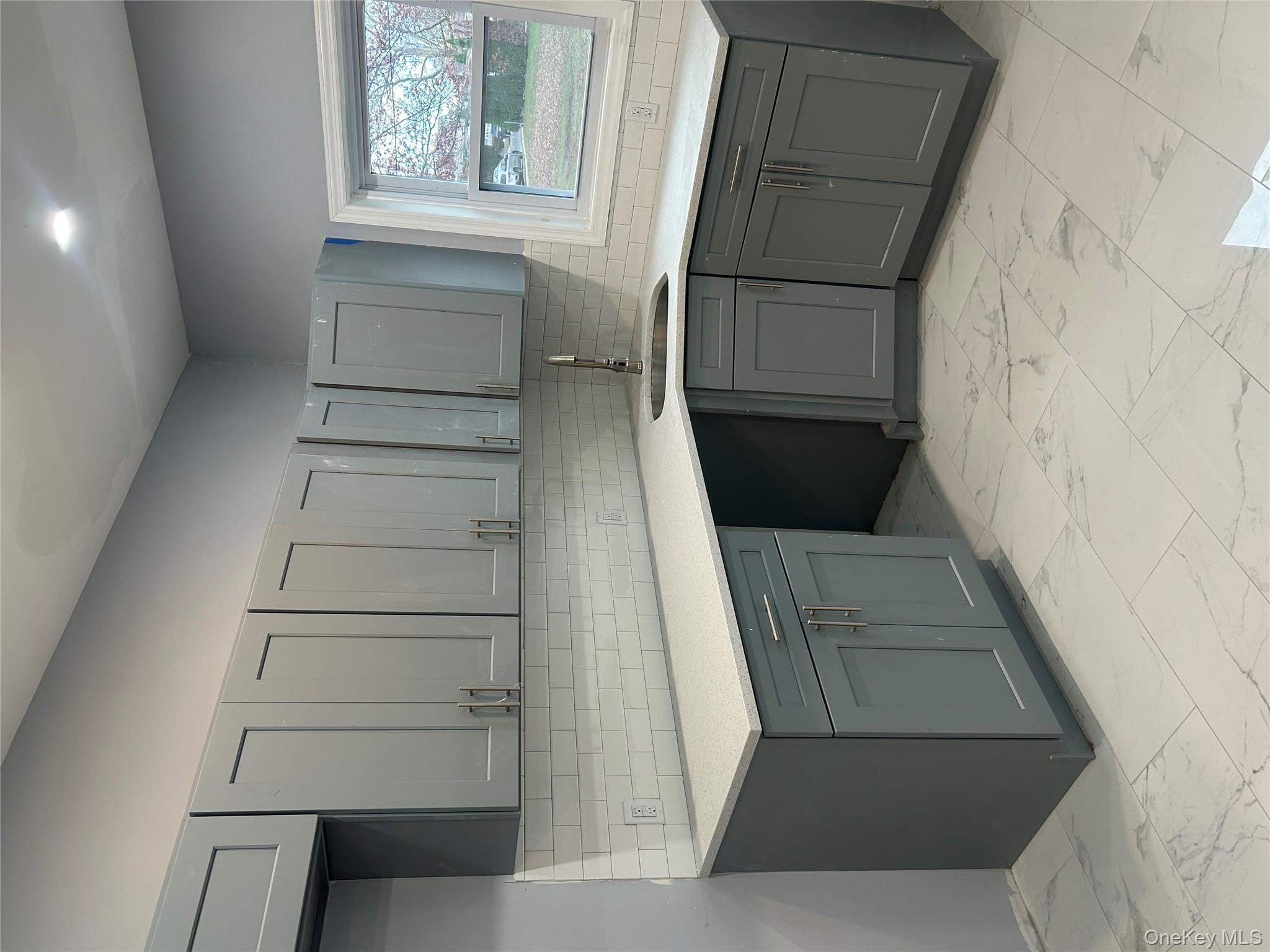 a kitchen with stainless steel appliances granite countertop a sink and cabinets