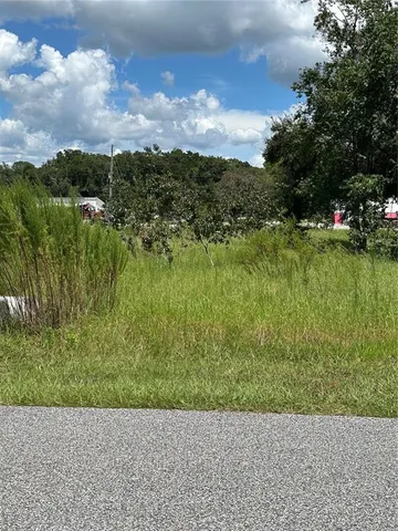 a view of a lake with a building in the background
