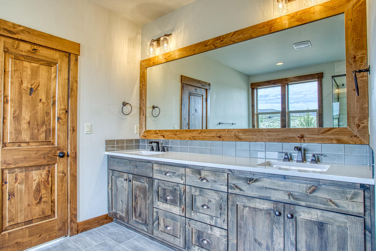 15751 South W Brasada Ranch Road, Unit LOT 363 Powell Butte, OR 97753 - Photo 26 of 47 a bathroom with mirror sink and vanity