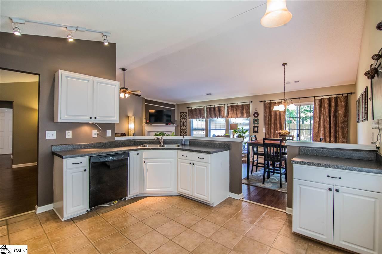 303 Woolridge Way Greer, SC 29650 - Photo 10 of 33 Kitchen has vaulted ceiling and ceramic tile flooring