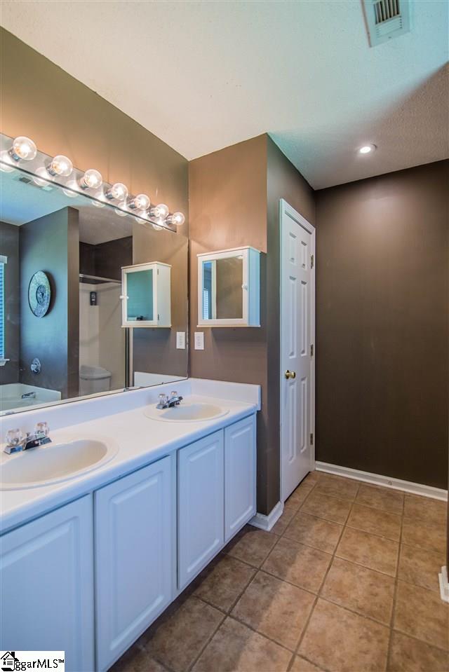 303 Woolridge Way Greer, SC 29650 - Photo 15 of 33 Owners Suite Bathroom, Double Vanity, Ceramic Tile Flooring, Linen Closet, Garden Tub, Shower with Glass Door