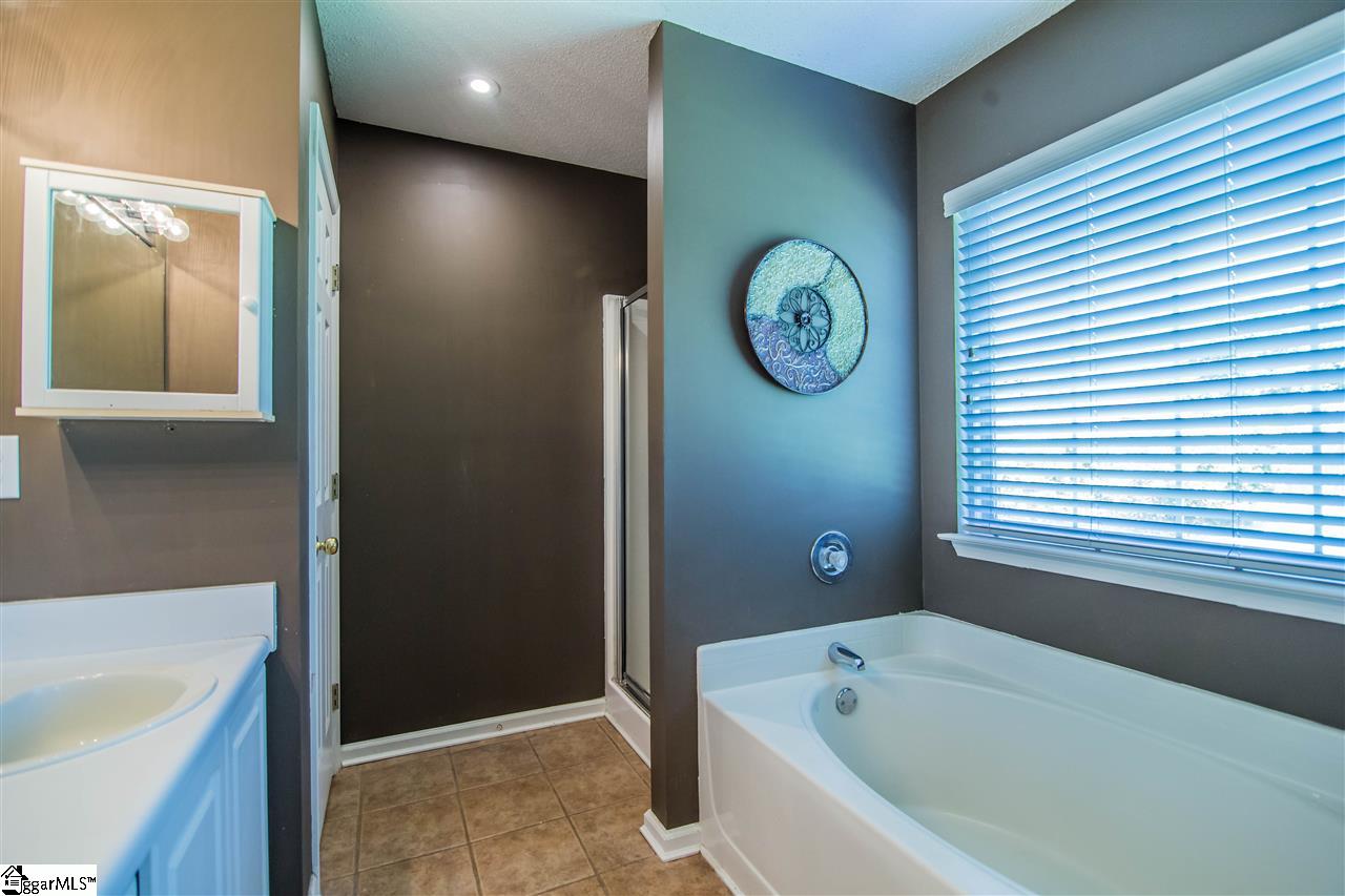 303 Woolridge Way Greer, SC 29650 - Photo 16 of 33 Owners Suite Bathroom, Double Vanity, Ceramic Tile Flooring, Linen Closet, Garden Tub, Shower with Glass Door