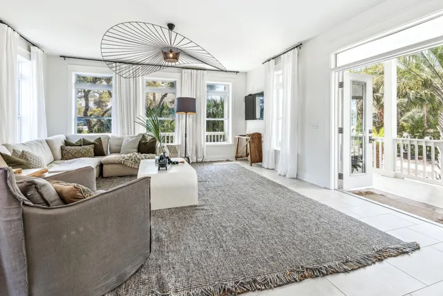 a kitchen with stainless steel appliances a table chairs and a refrigerator