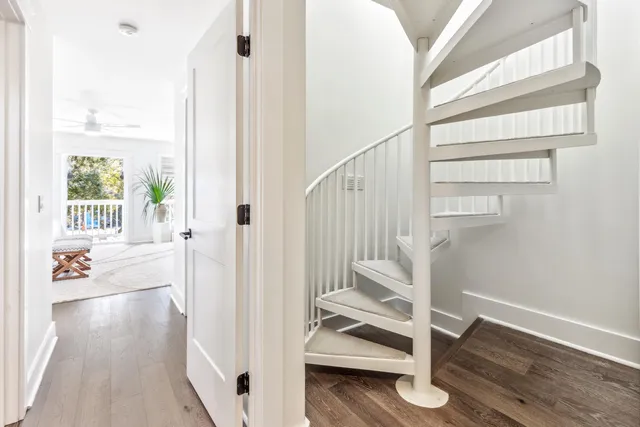 a view of a room with wooden floor and wooden fence