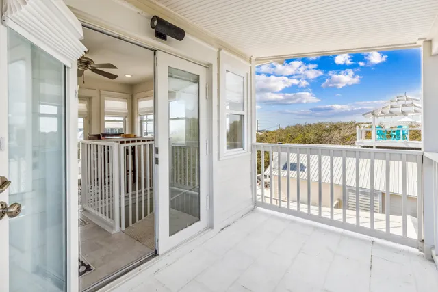 a view of a balcony with wooden floor and city view