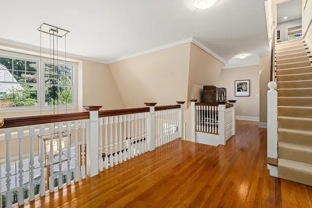 a view of entryway with stairs and wooden floor