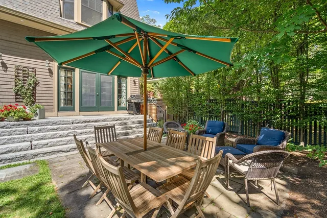 an outdoor space with furniture and umbrella