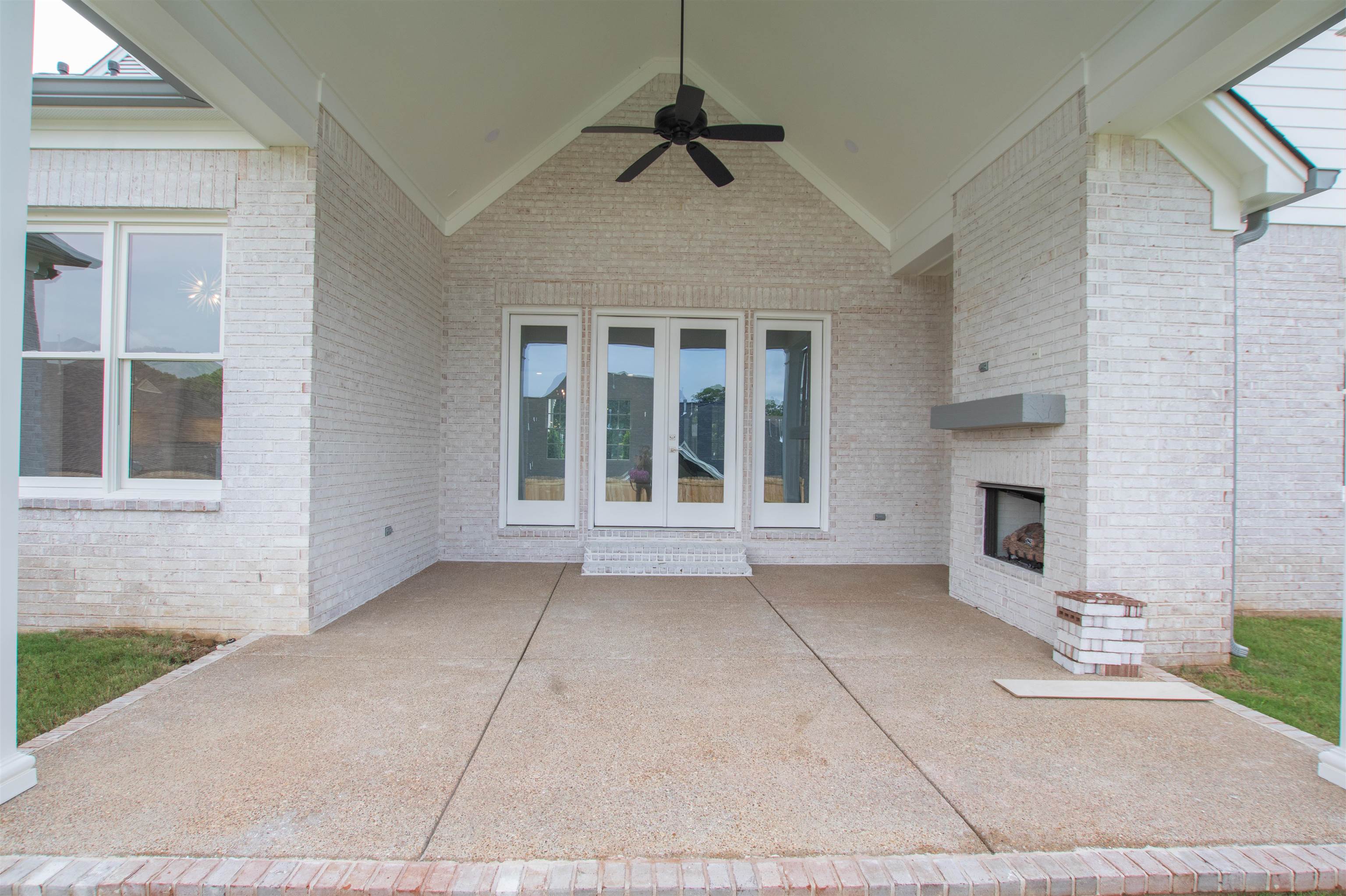 2611 Moore Road Germantown, TN 38138 - Photo 5 of 35 View of patio with an outdoor brick fireplace and ceiling fan