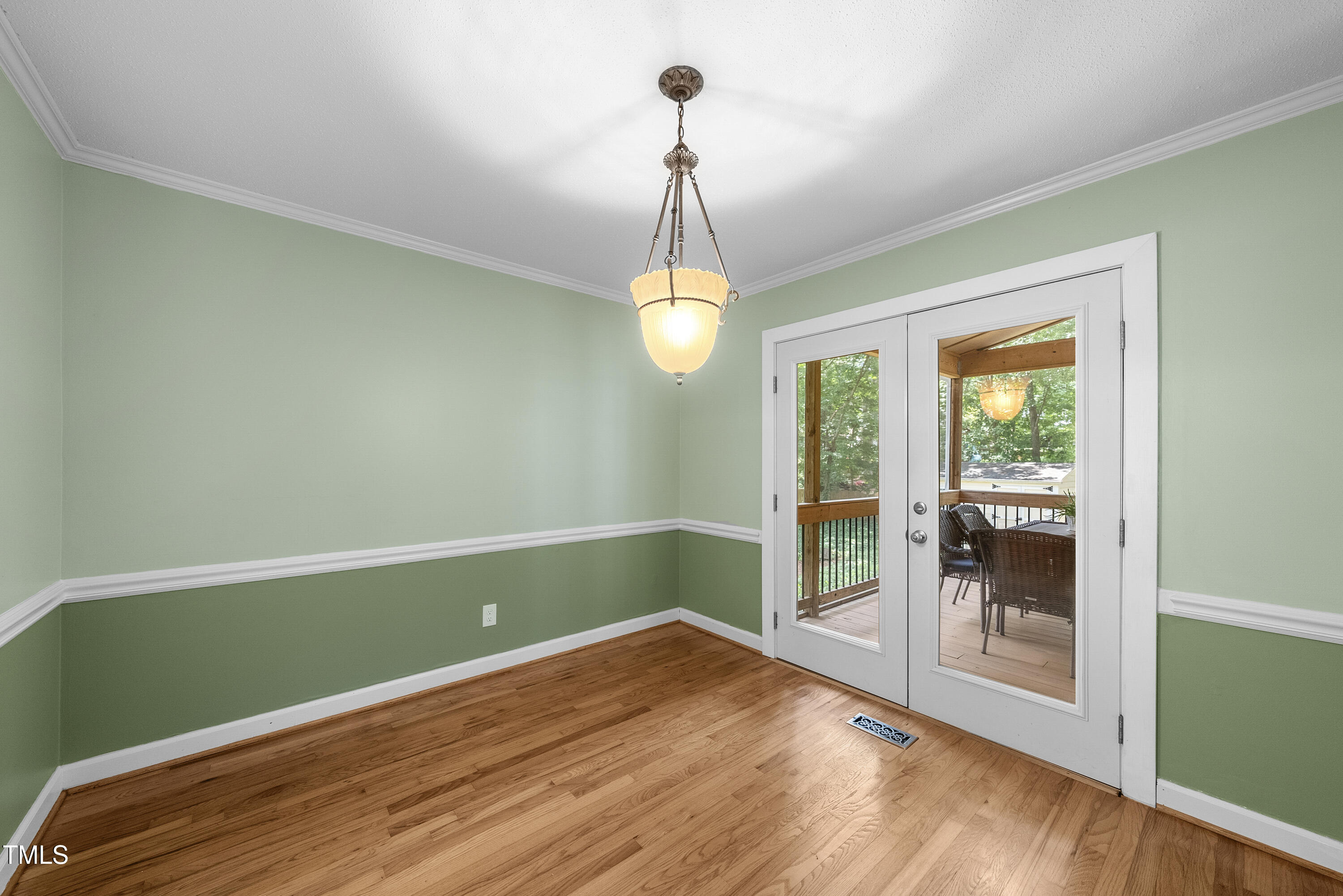 8629 Windjammer Drive Raleigh, NC 27615 - Photo 19 of 56 Dining room out to Screened porch