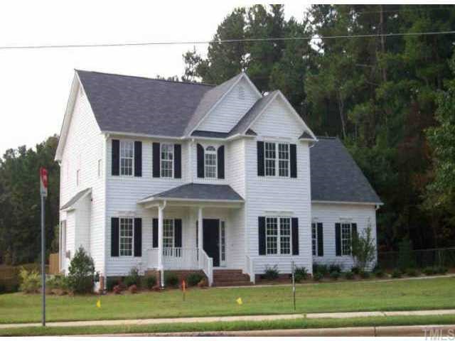 1699 Lynn Road Raleigh, NC 27612 - Photo 1 of 1 a front view of a house with a yard