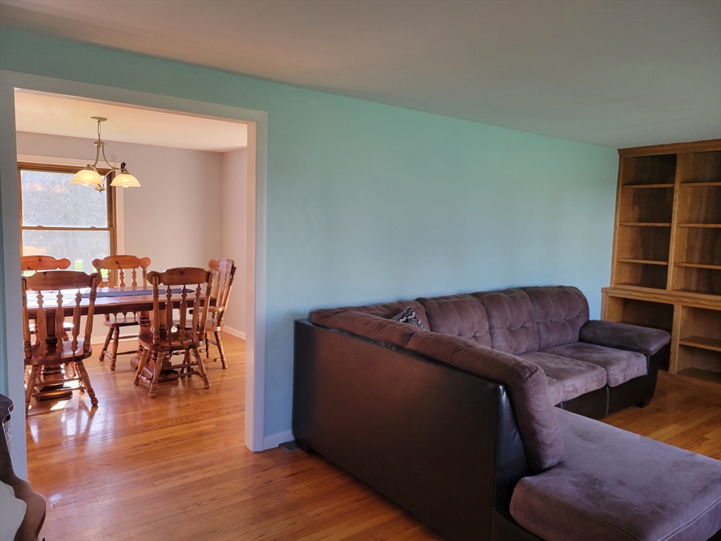 260 Wolcott Avenue West Springfield, MA 01089 - Photo 9 of 25 a living room with furniture and a wooden floor