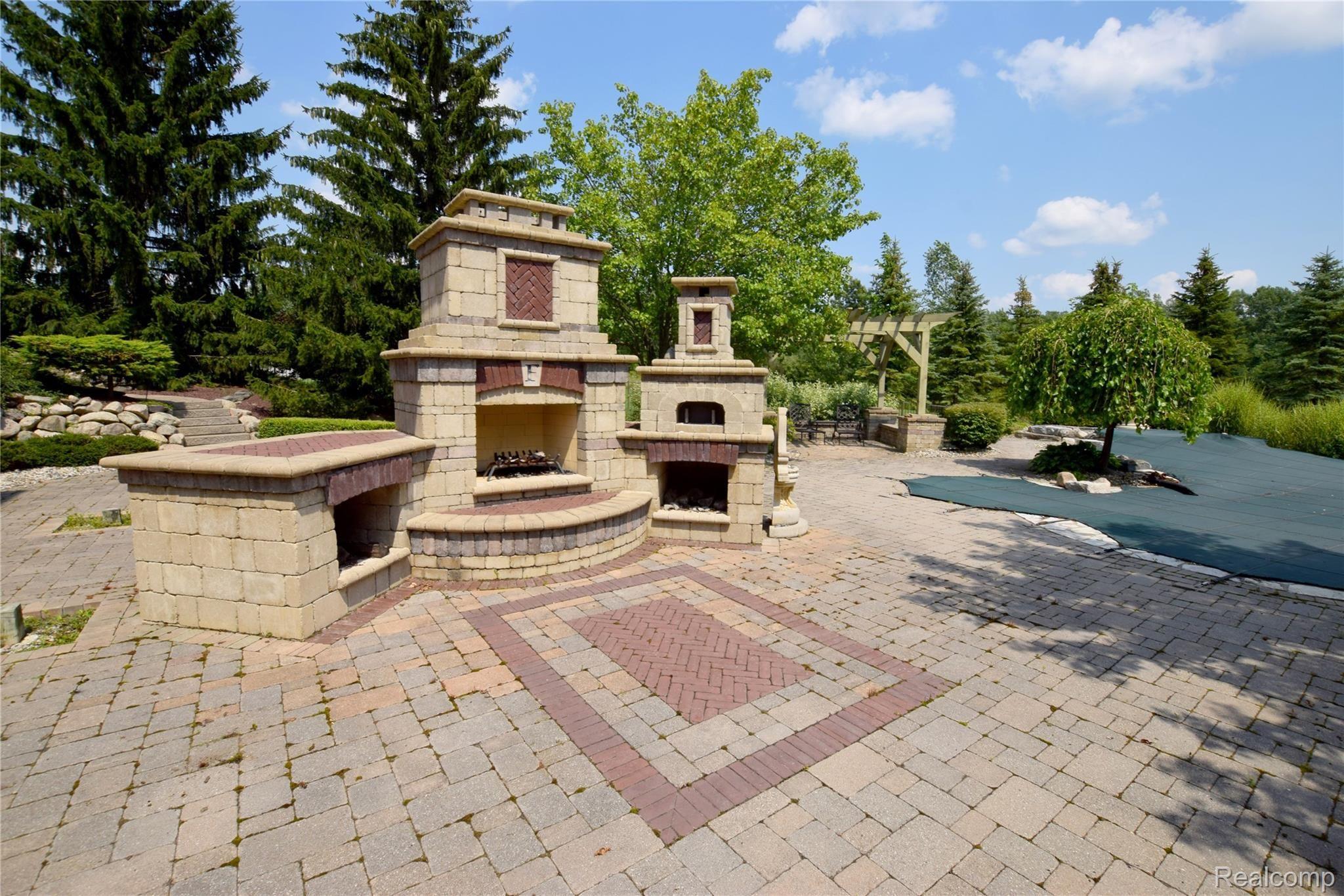 11471 Sharp Road Linden, MI 48451 - Photo 30 of 38 Fireplace plus pizza oven.
