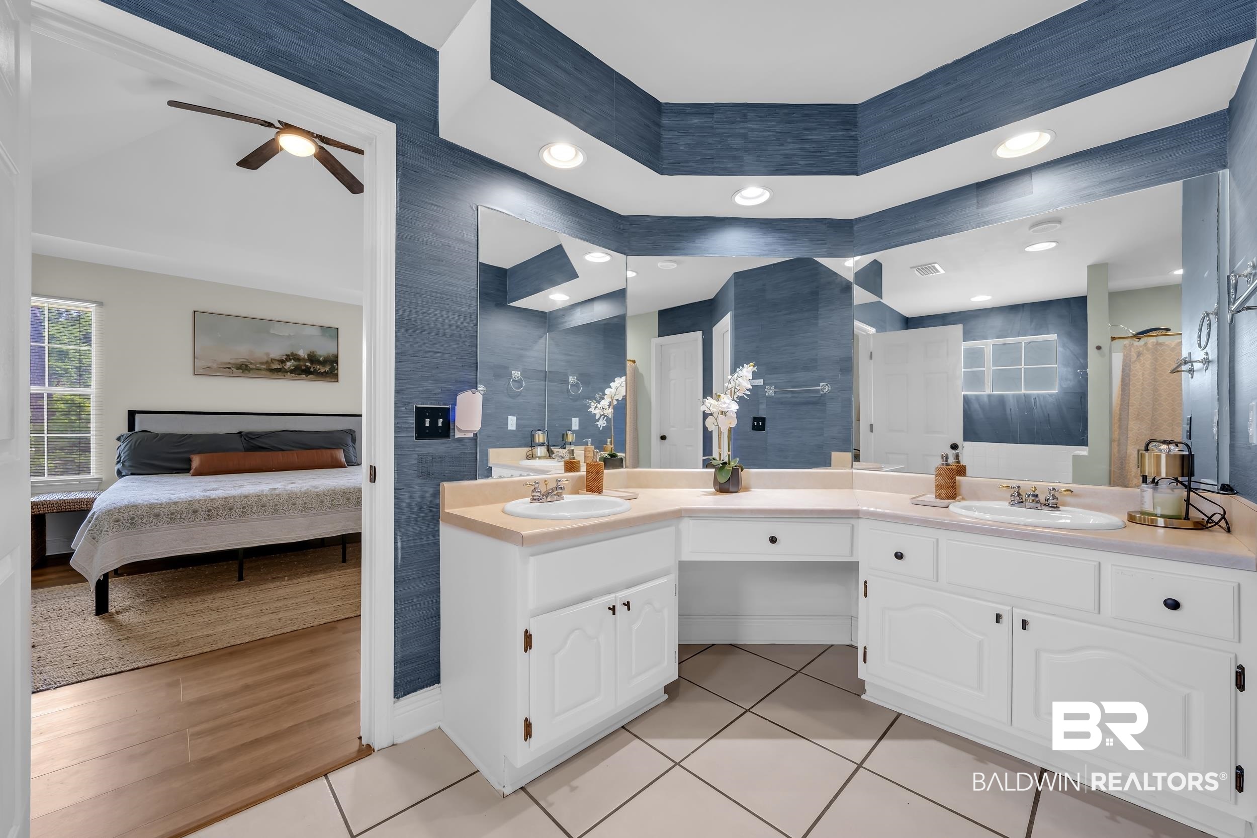 509 Loblolly Court Foley, AL 36535 - Photo 15 of 26 Bathroom featuring dual vanity with white cabinetry, light countertops, and integrated sinks