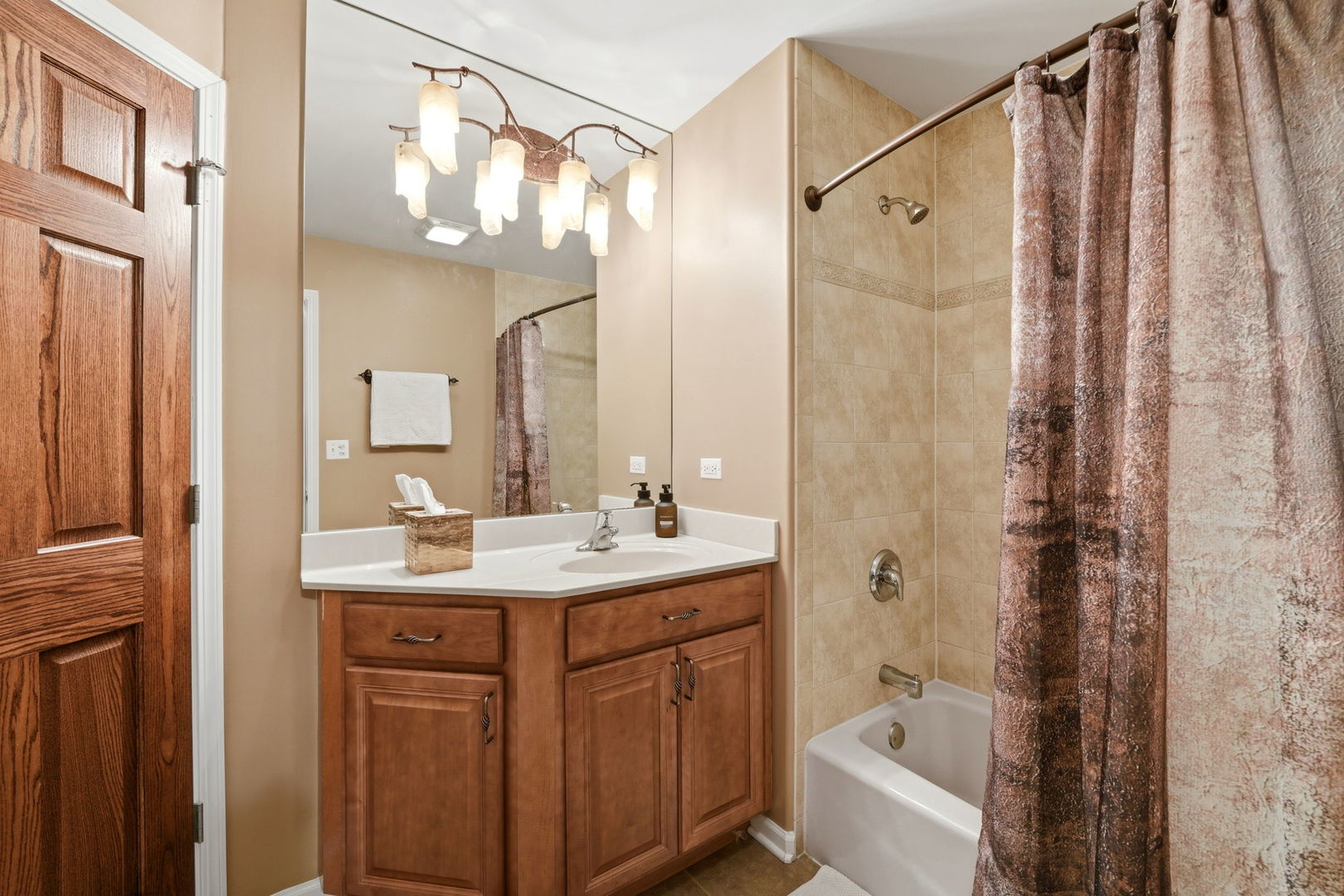 1406 Rue Paris Place Inverness, IL 60067 - Photo 21 of 35 a bathroom with a sink a toilet and a mirror