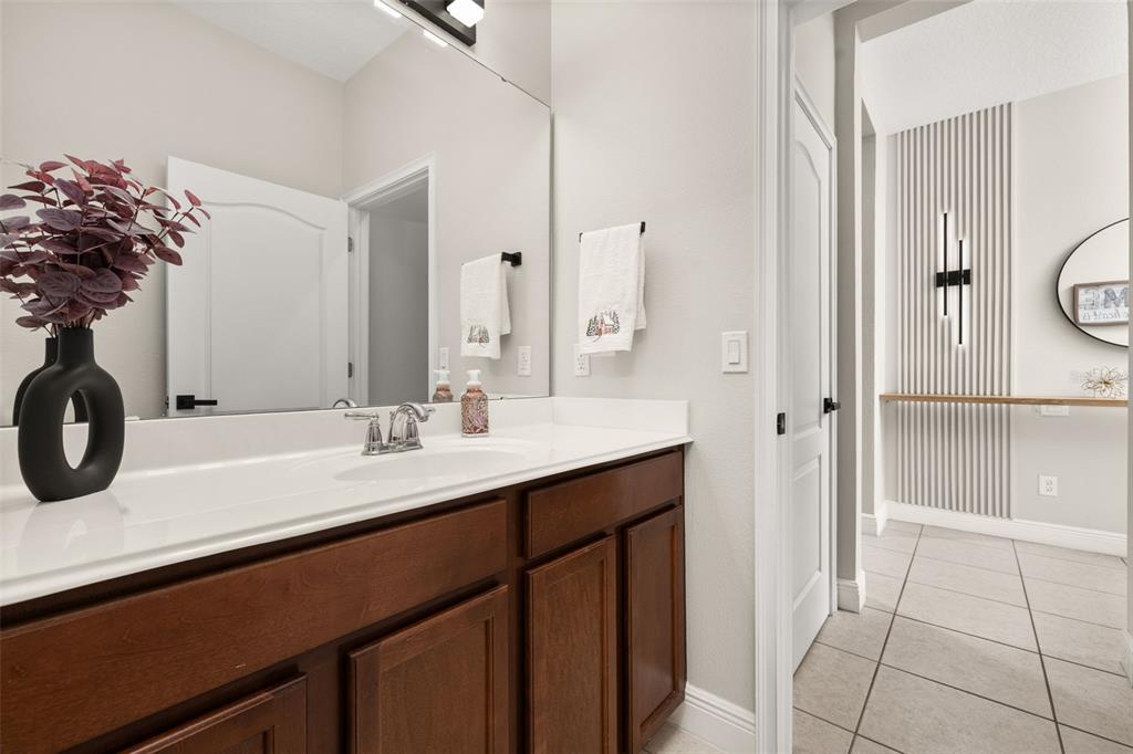 12333 Via Derna Place Windermere, FL 34786 - Photo 21 of 56 a bathroom with a sink and a mirror