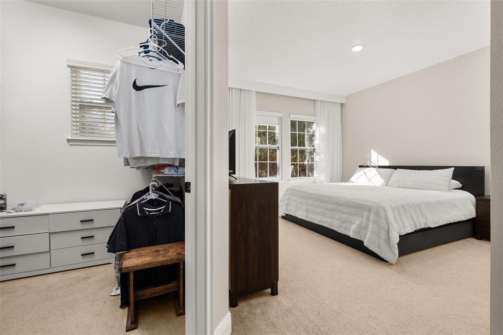 12333 Via Derna Place Windermere, FL 34786 - Photo 33 of 56 a bedroom with a bed and a dresser